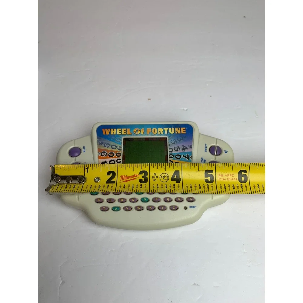 Y2K Wheel of Fortune Handheld Electronic Game 2005 ‎ Retro Puzzle Works
